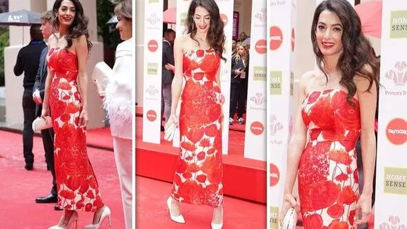 В Лондоне 44-летняя Амаль Клуни  вышла на дорожку церемонии премии Prince's Trust Awards в элегантном красном платье и  белых шпильках - жена Джорджа Клуни подчеркнула свою красоту яркой помадой 
